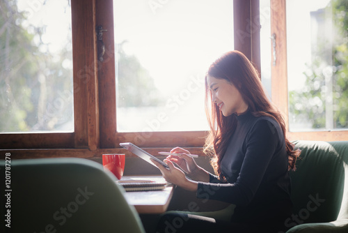A confident young Chinese woman enjoys a peaceful coffee break in a modern cafe. Surrounded by city life, she relaxes with a book and portable device, balancing work, leisure, and indulgence. Free Download A confident young Chinese woman enjoys a peaceful coffee break in a modern cafe. Surrounded by city life, she relaxes with a book and portable device, balancing work, leisure, and indulgence. - GFXLoad