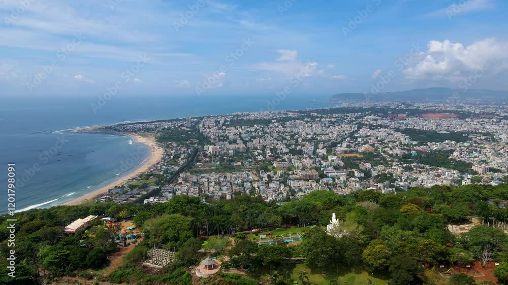 Breathtaking aerial drone shot of Vizag’s iconic skyline and coastal roads, highlighting the dynamic energy of the city. Breathtaking aerial drone shot of Vizag’s iconic skyline and coastal roads, highlighting the dynamic energy of the city.