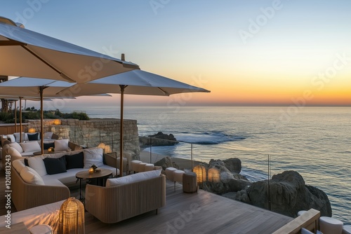 Hotel terrace overlooking the ocean, soft waves, and cozy ambiance