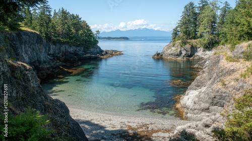 A scenic cove with calm, clear water surrounded by rugged cliffs. photo