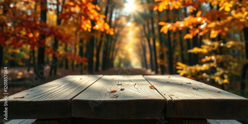 A weathered wooden table sits invitingly in the middle of a sun-drenched autumn forest, offering a peaceful retreat surrounded by vibrant foliage.