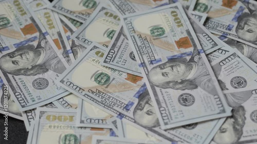 Wallpaper Mural American dollars fall on the table. A pile of hundred dollar bills Torontodigital.ca