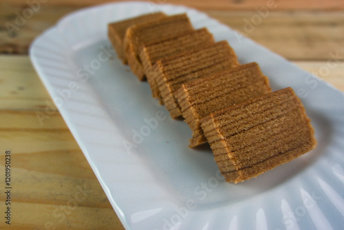 Lapis legit or spekuk (Dutch: Spekkoek) is a type of traditional wet cake from Indonesia. photo