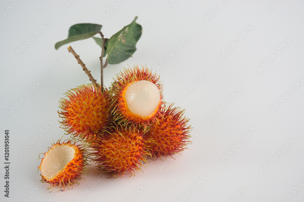 Fresh Rambutan Fruits With Leaf on a Plain White Background Fresh Rambutan Fruits With Leaf on a Plain White Background