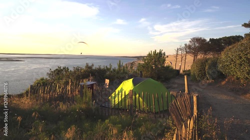 tent camping in nature on the edge of the ocean in summer