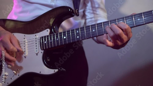 Electric bass guitar player hands. Guitar and guitarist. Live music. Close-up. Slow-mo