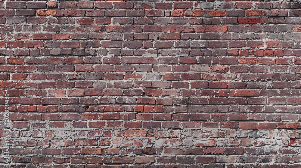 Naklejka premium Exposed brick wall with uniform textures, showcasing rustic and industrial feel. weathered appearance adds character and depth to any space