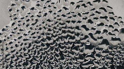 Water vapor condenses on metal surfaces