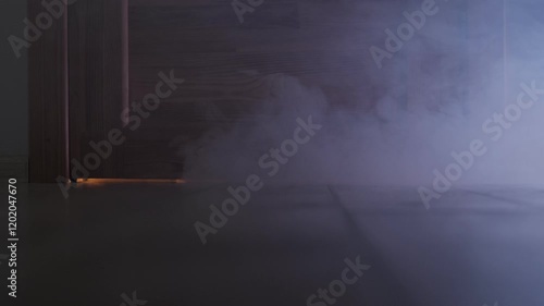 Smoke fire in the apartment. A fire starts in the house at night. Close up smoke comes out from under the door