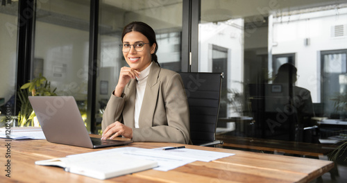 Εκτύπωση καμβά Portrait at camera financial it specialist latin hispanic business lady working on laptop pc in office