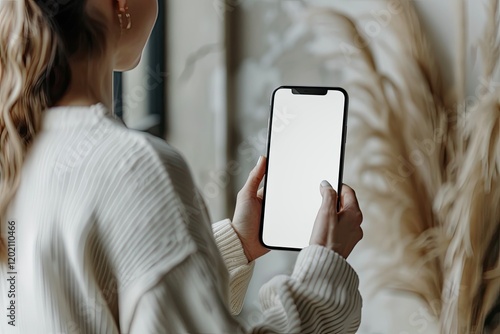 Woman Browsing Photos on Social Media App, Persons Name on Screen is Made Up photo