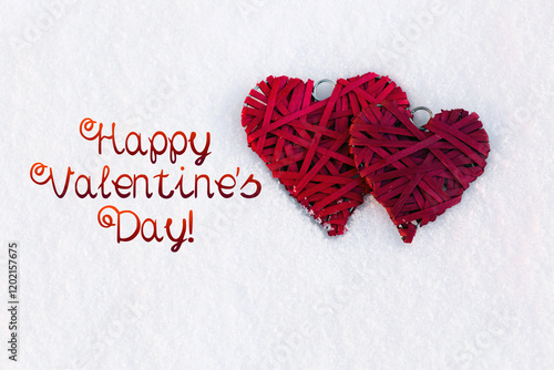 Happy Valentines day background with two red hearts on white snow .