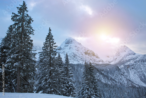 Winter landscape with sunset and Alpine mountains