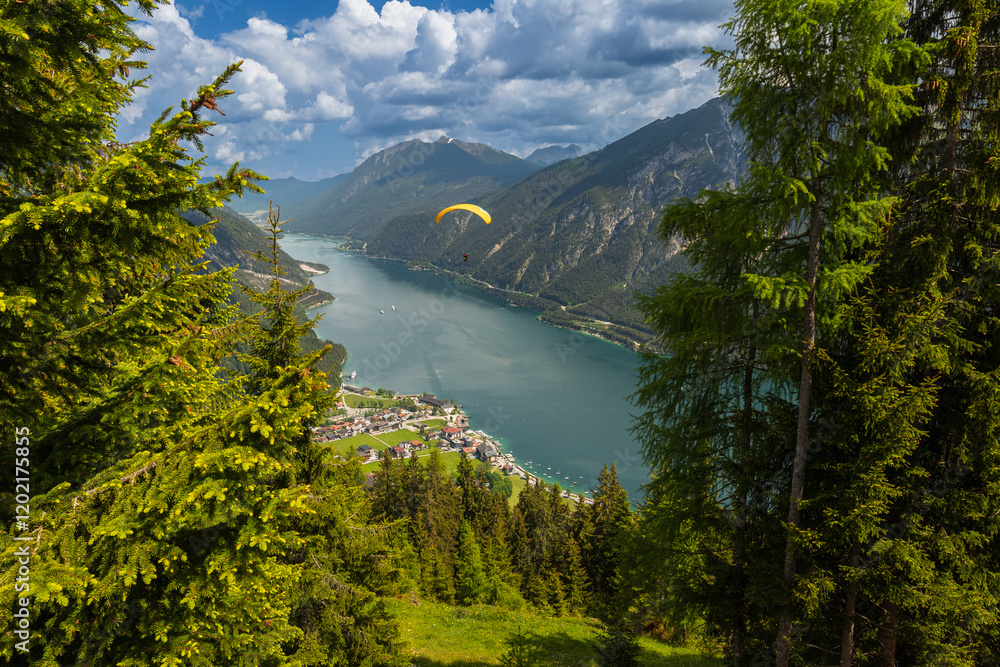 paraglider flyying in the alps at Achensee in austria