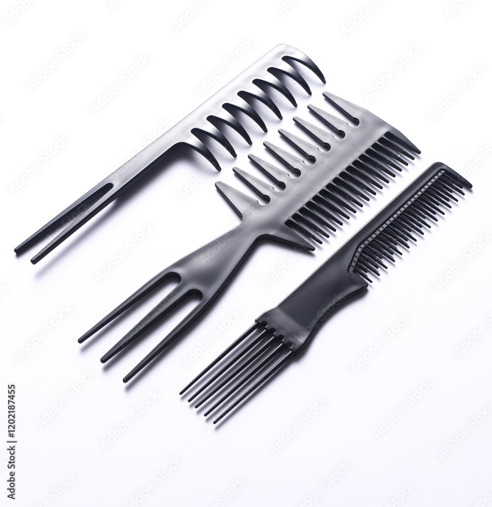 Set of black plastic combs on white background Set of black plastic combs on white background