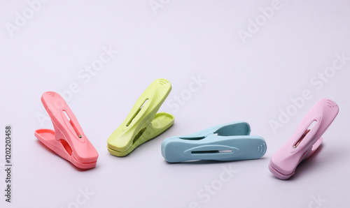 Plastic clothespins on a white background photo