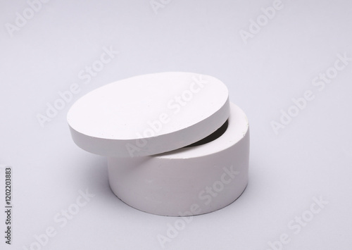 White plaster candle box on grey background
