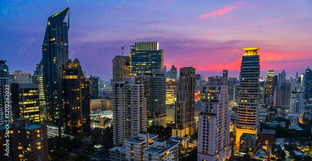 Obraz premium Vibrant sunset over the skyline of Bangkok showcasing urban development and a bustling city life