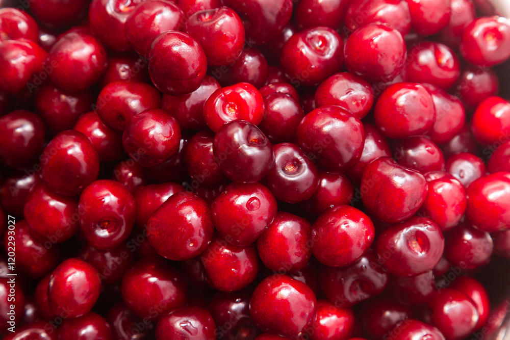 Heap of ripe red sweet cherries, close-up. Cherry background. Heap of ripe red sweet cherries, close-up. Cherry background.
