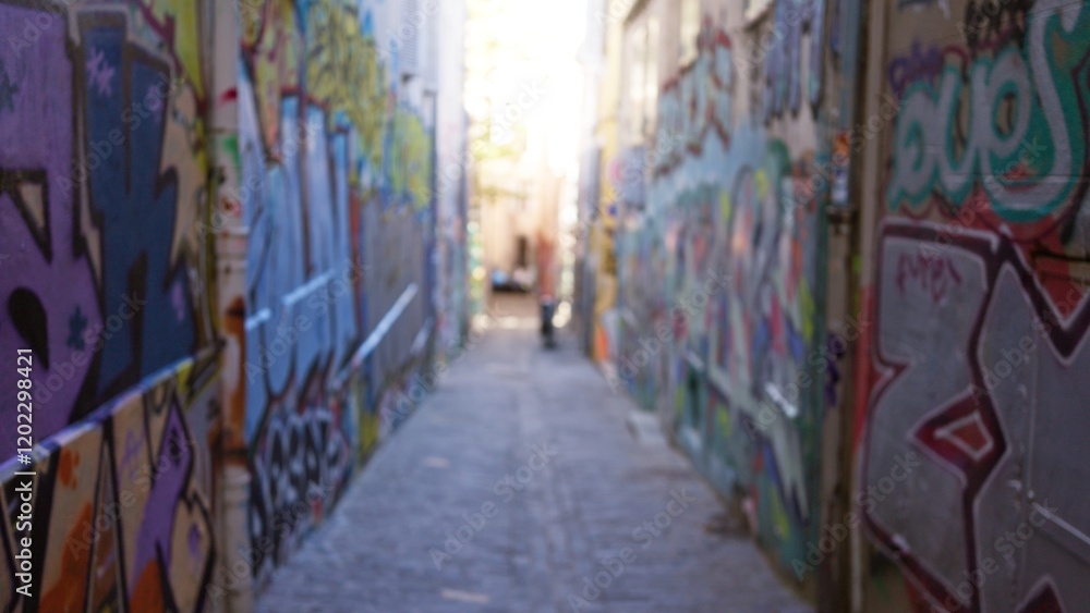 Blurry street with colorful graffiti creating a vibrant urban alleyway, showcasing defocused art in an outdoor ghetto setting. Blurry street with colorful graffiti creating a vibrant urban alleyway, showcasing defocused art in an outdoor ghetto setting.