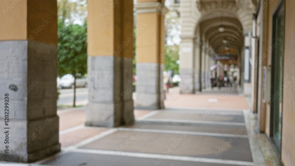 Defocused view of a street in la spezia, italy, showcasing blurred architecture and bokeh effect, capturing the essence of a bustling european town under elegant archways. Defocused view of a street in la spezia, italy, showcasing blurred architecture and bokeh effect, capturing the essence of a bustling european town under elegant archways.
