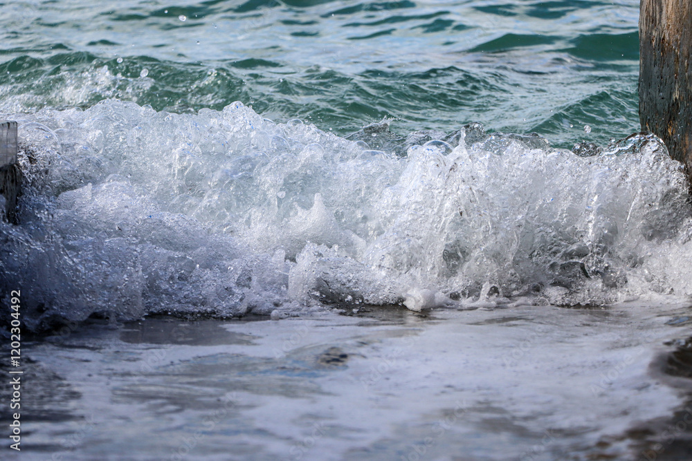 Fototapeta premium Sea wave rolling on the coast rocks