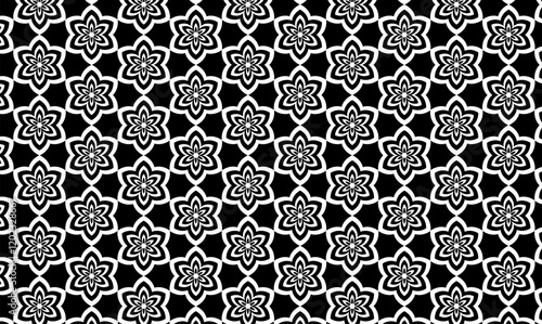 Black and white floral geometric pattern with interconnected flower shapes.