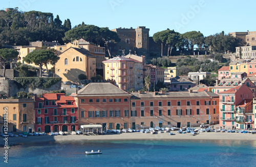 Sestri Levante, Italy - January 17, 2025. View from rock on sea, Bay of Silence, fishing cove of the town of Sestri-Levante, Italy. Tourism and recreation. Ecologically clean nature. Traditional old photo