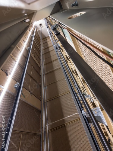 Obraz na płótnie Reconstruction of elevator shaft with ropes and LED lights, vertical w salonie