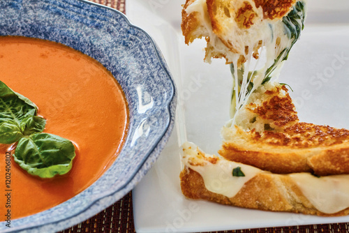 Obraz na plátně tomato basil soup served with a grilled cheese sandwich