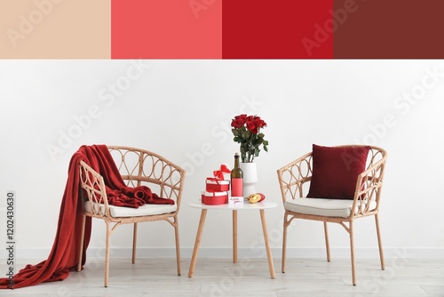 Armchairs, gifts for Valentine's Day and red wine with rose flowers on table in room. Different color patterns