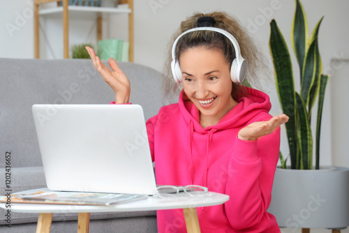 Mature woman with laptop an...