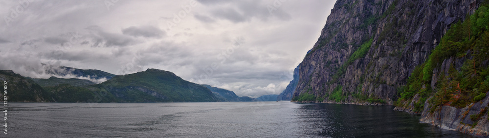 Norway Coast Fjord view from boat on ocean. Mountains, forests, waterfalls and small towns. Scandinavia, Norway Norway Coast Fjord view from boat on ocean. Mountains, forests, waterfalls and small towns. Scandinavia, Norway