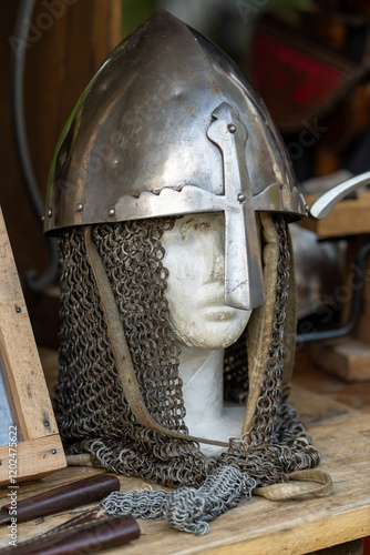A helmet with a chain around it is on a table