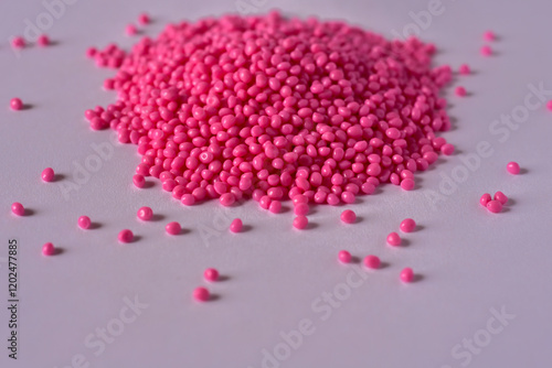 Pink masterbatch granules on white background,color pigment carrier polymer in plastic industry,suitable for plastic company catalog design photo