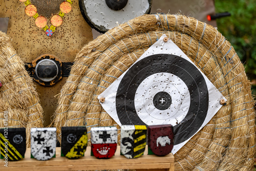 A wooden board with a black and white target on it