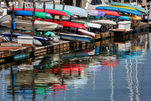 USA, California, San Diego. America's Cup Harbor, kayaks, boat rack, and reflections photo