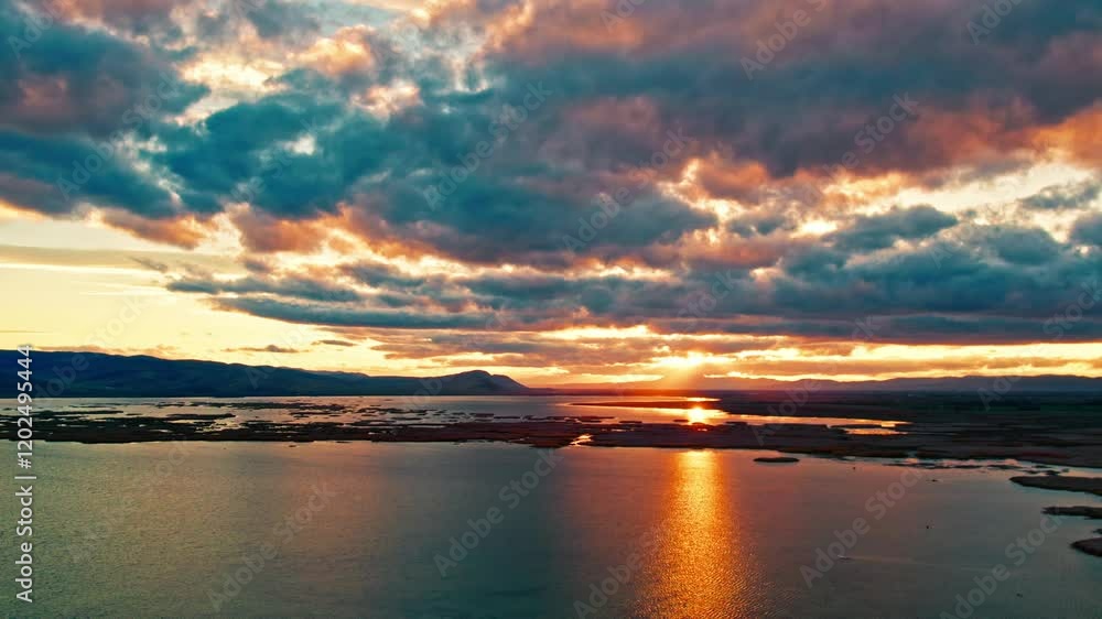 A breathtaking landscape showcasing the serene harmony of the sky and lake with nature's calming colors. Perfect for those seeking peace. A breathtaking landscape showcasing the serene harmony of the sky and lake with nature's calming colors. Perfect for those seeking peace.