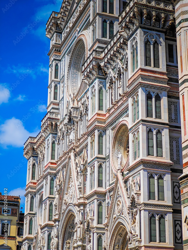 Fototapeta premium Cathedral of Santa Maria del Fiore. Fragments and elements of Florence Duomo basilica facade. Close up dome photo