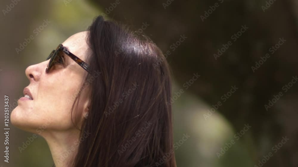 Middle-aged female, cool shades stylish fashions, mobile technology