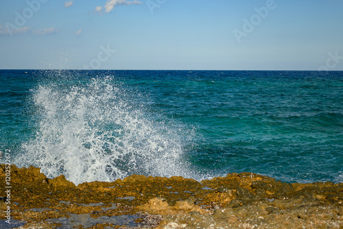 Splashing Ocean Waves on Rocky Coastline
