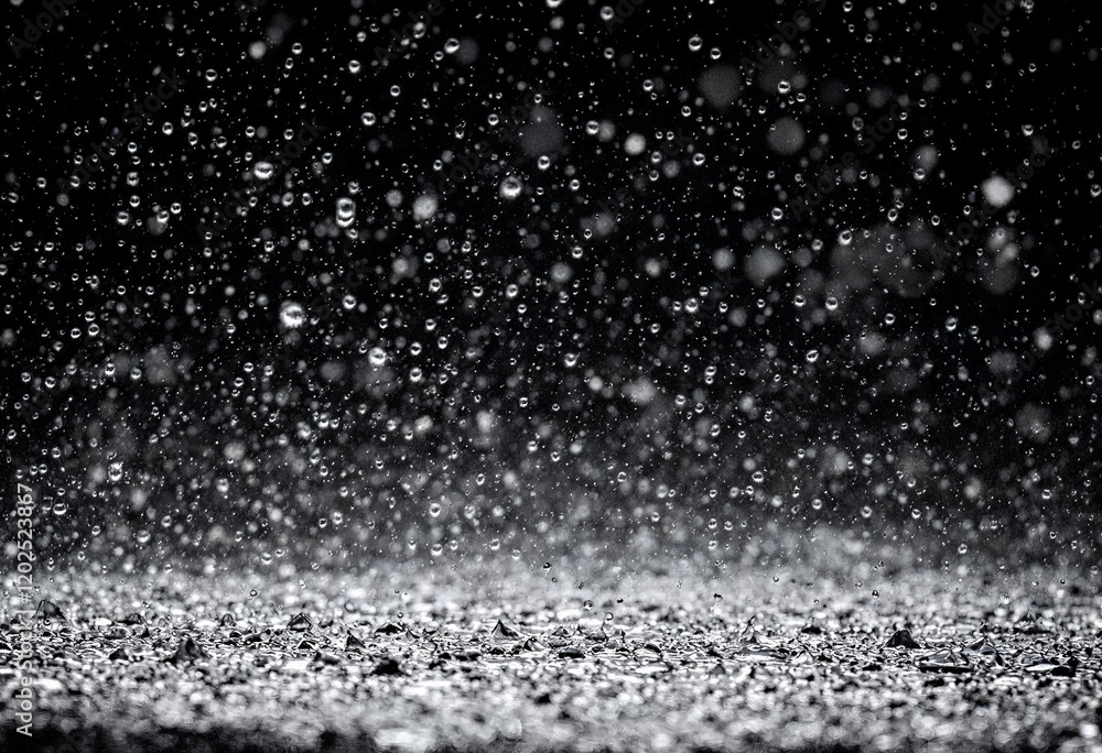 Heavy raindrops splashing on the ground Heavy raindrops splashing on the ground