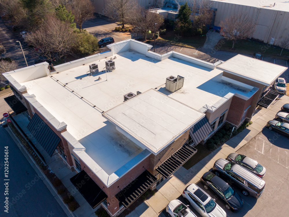 Fototapeta premium Sunny Day Time Drone Images of a TPO Roof on a Commercial Building.