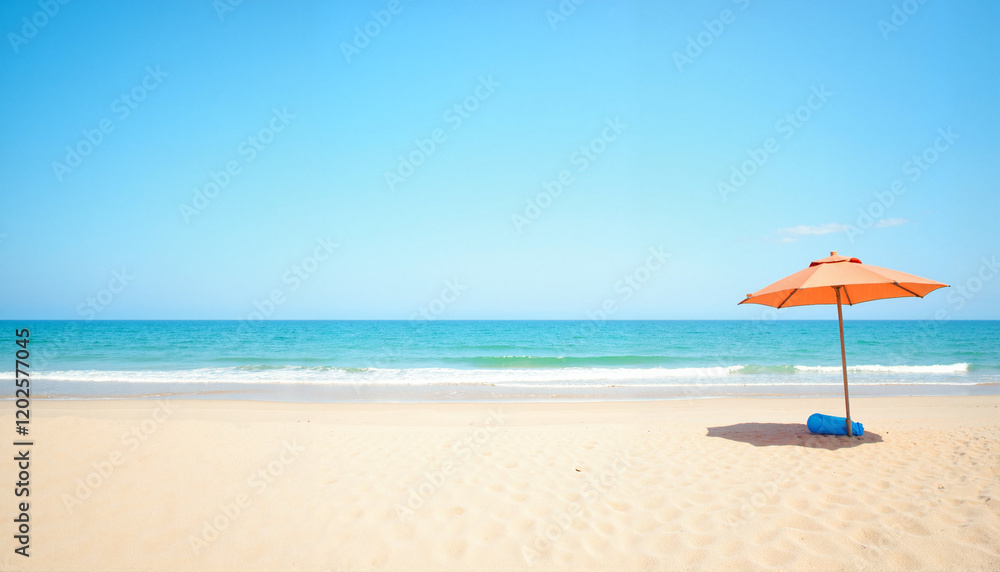 Beach umbrella on sandy shore with calm ocean background