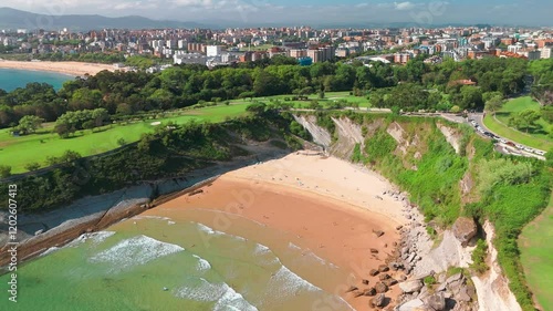 Beautiful green coast of Santander with high cliffs and sandy beach, Spain. photo