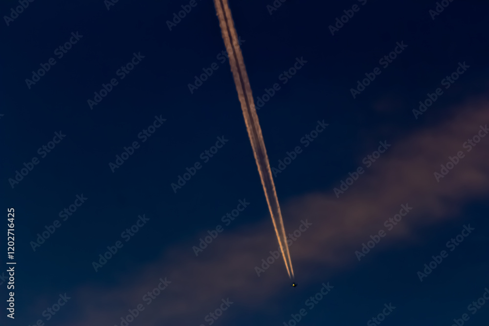 Airplane in the blue sky with contrails in the air. Airplane in the blue sky with contrails in the air.