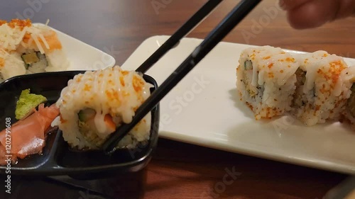 Indulge in a visual and culinary feast with this stunning sushi platter. Artistically arranged on this masterpiece showcases an array of delectable sushi rolls.