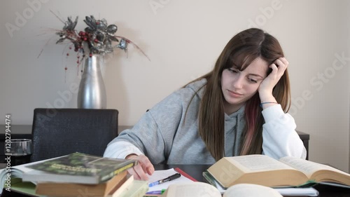 Depressed girl trying to study