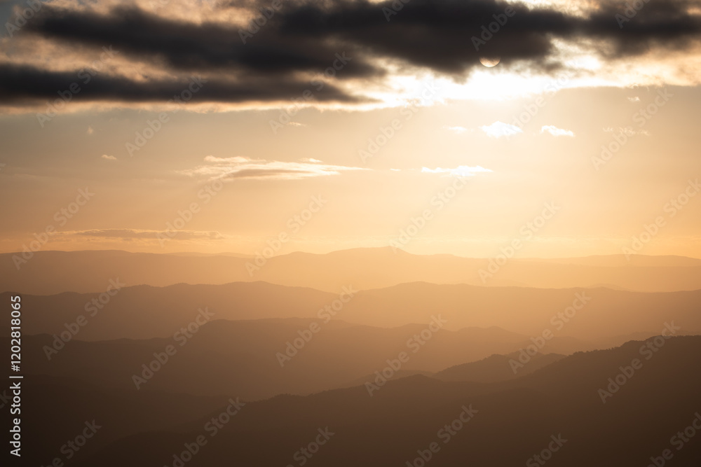 mountain range orange sunset clouds sky mountain range orange sunset clouds sky