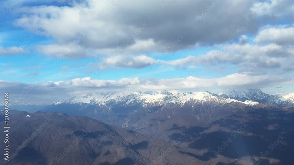 Panoramic view of the snow-covered mountains and the blue sky with clouds. Winter landscape. Krasnaya polyana, Sochi, Russia.
Panoramic view of the snow-covered mountains and the blue sky with clouds. Winter landscape. Krasnaya polyana, Sochi, Russia.